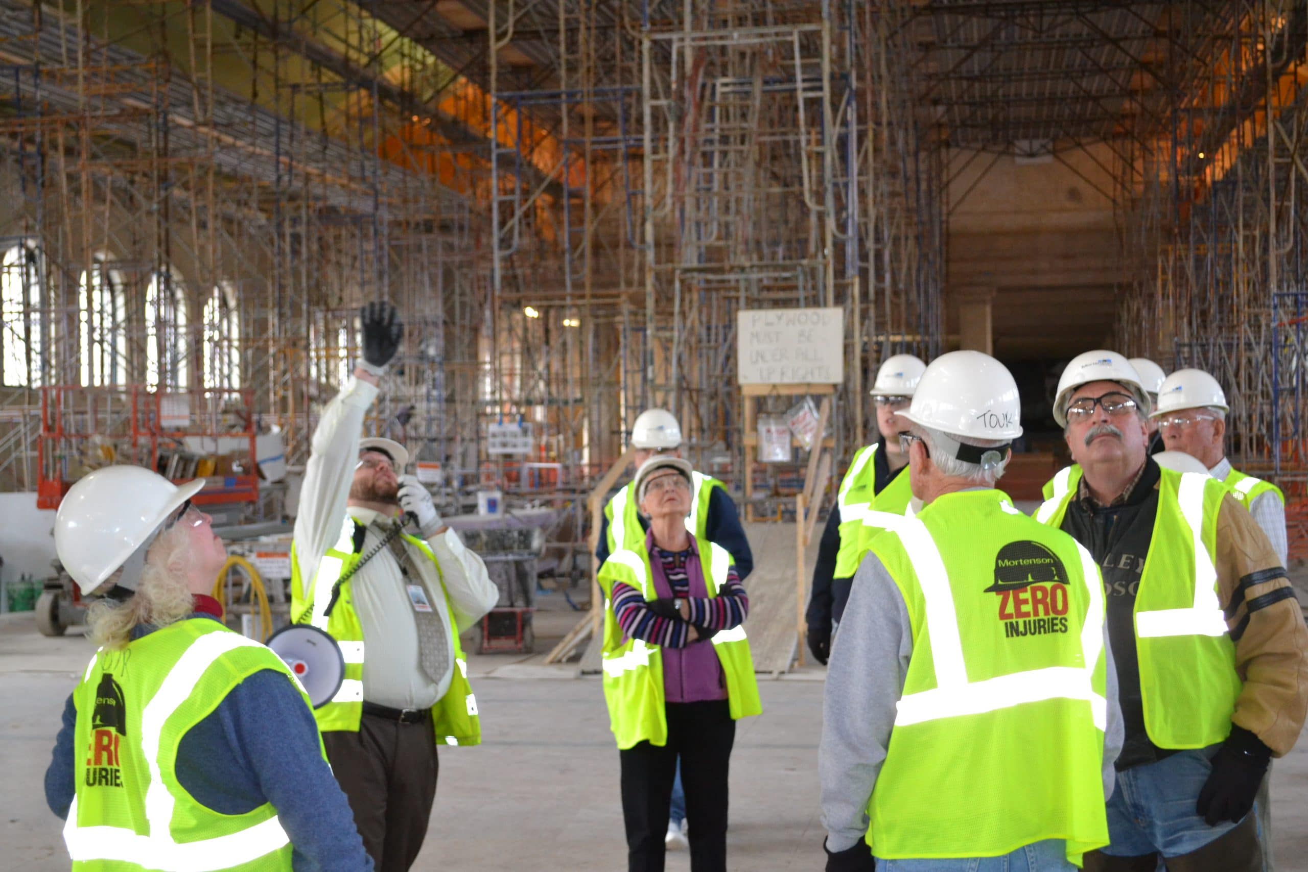 Workers examining Waiting Room under construction