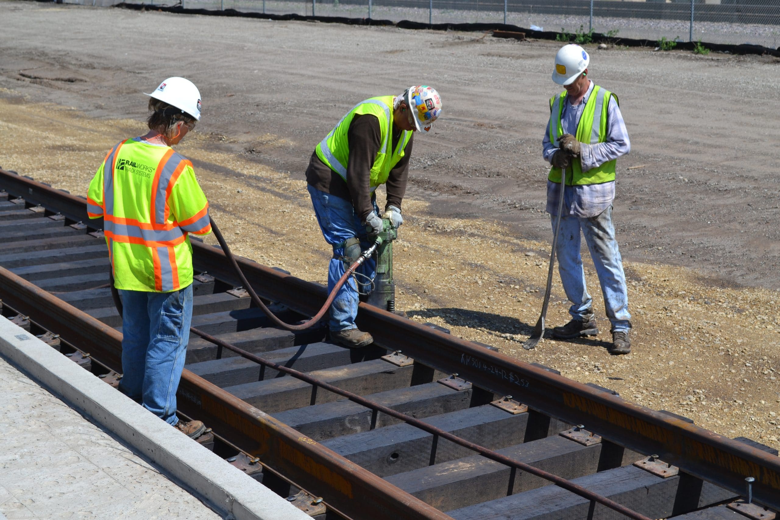 Workers working on train tracks outside