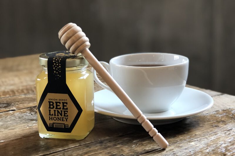 Bee Line honey jar and cup of tea