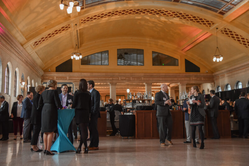 People talking at tables in Waiting Room at Union Depot