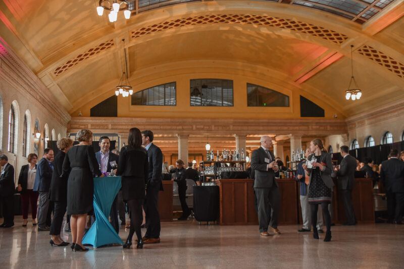 People talking at tables in Waiting Room at Union Depot