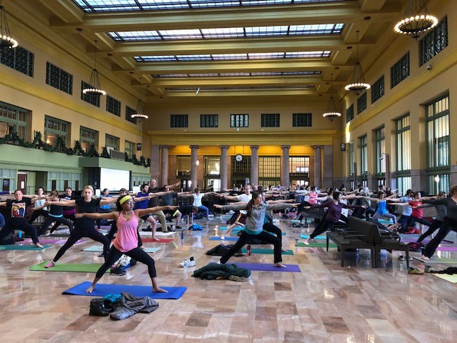 People doing yoga in Union Depot's Head House