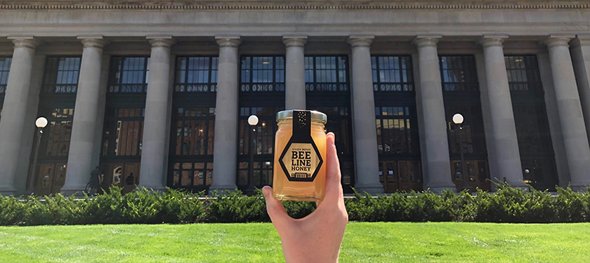 Bee Line Honey jar held out in front of North Plaza