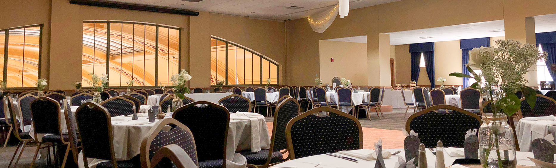 Red Cap Room with tables and flower arrangements