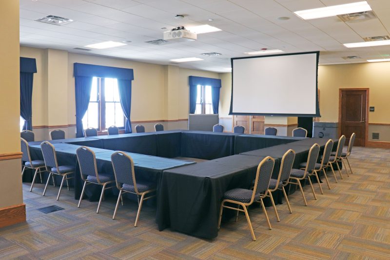 A view of the Veteran's Gallery with chairs and a screen