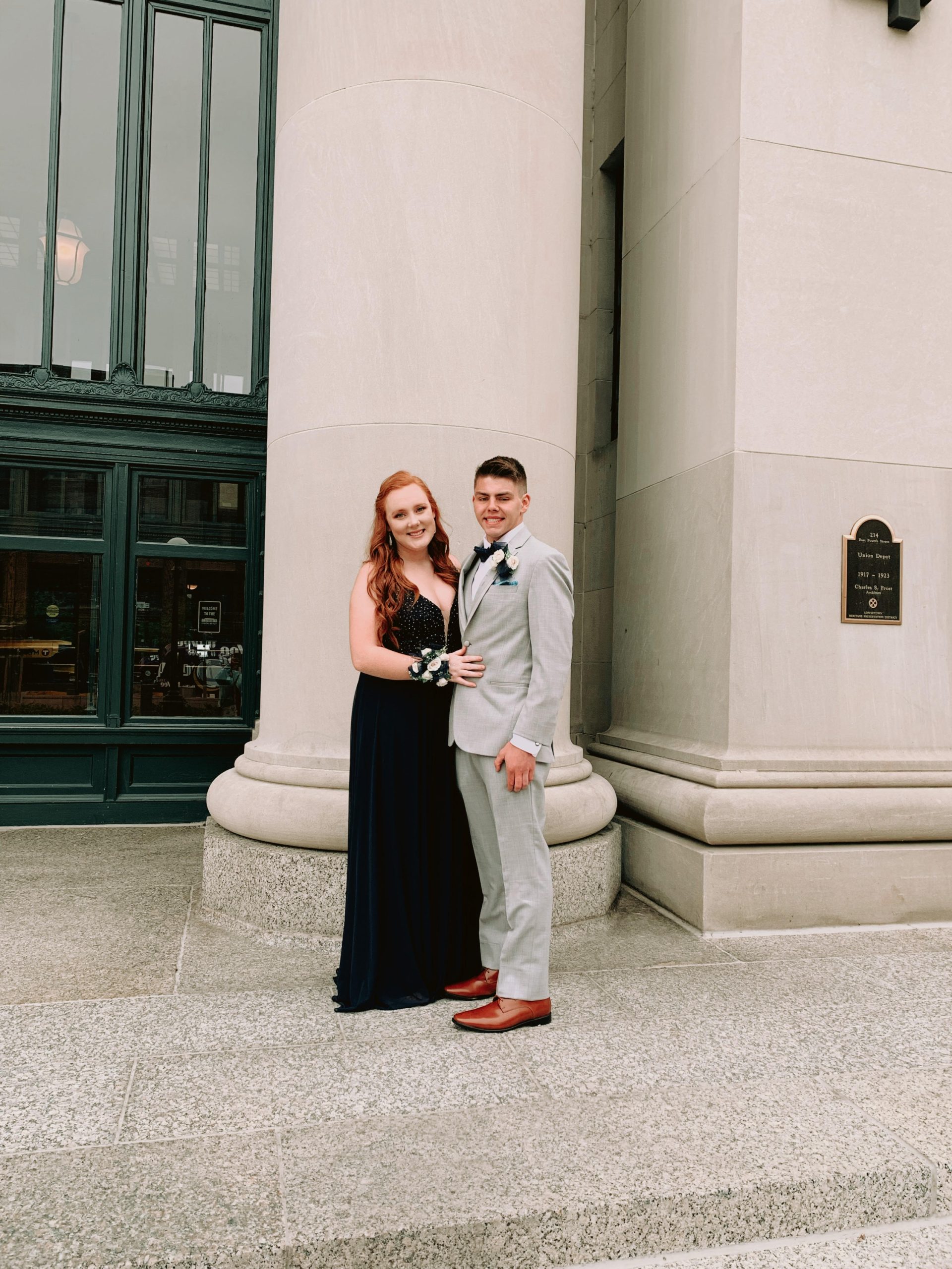A school dance couple standing in front of the Union Depot head house