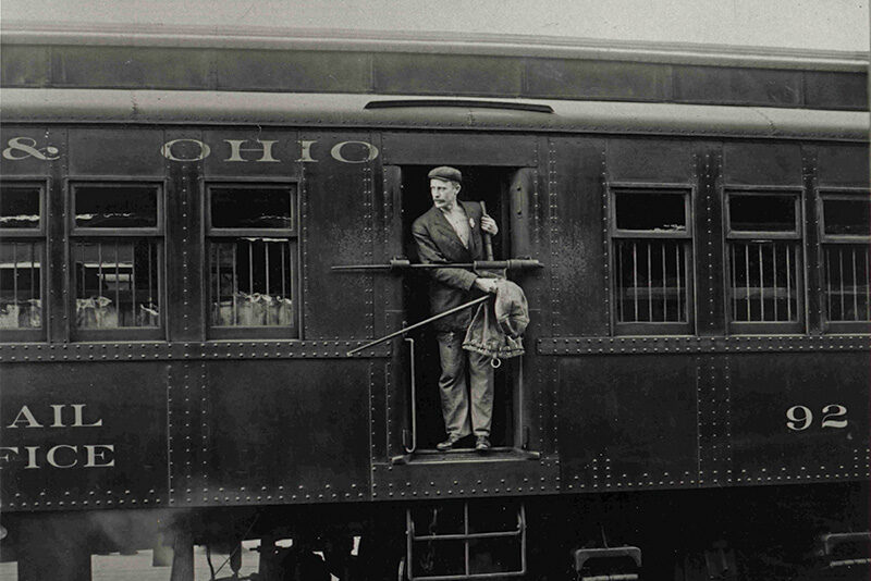 Railway post office clerk in mail car