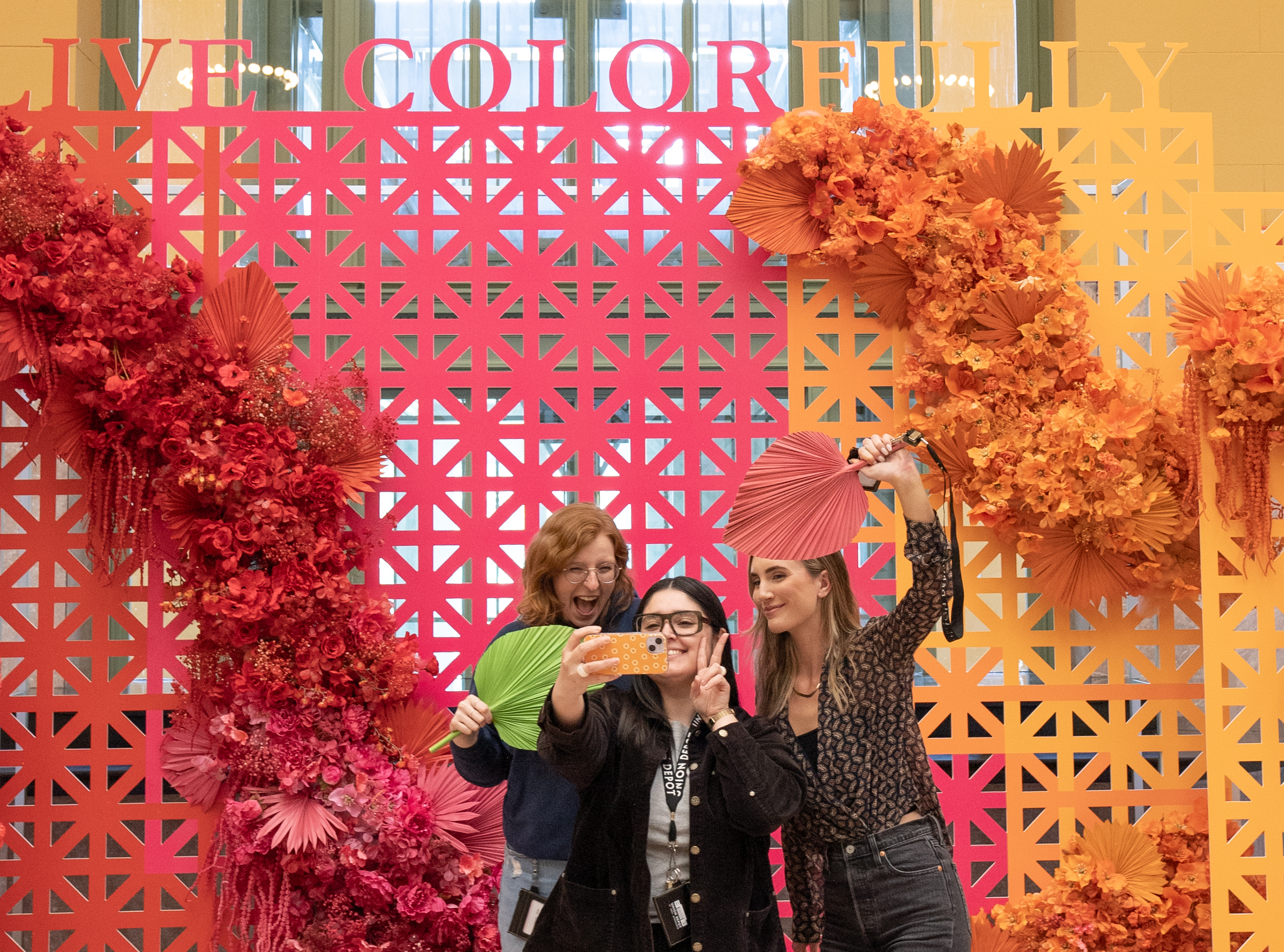 Women taking selfie in front of art installation