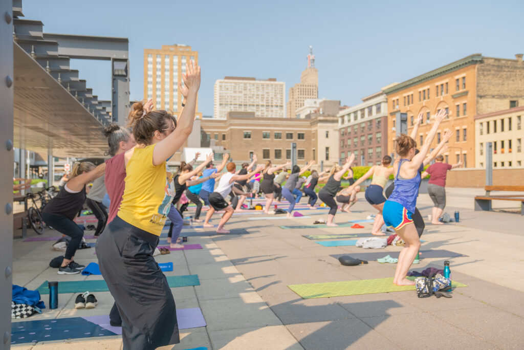 Wide angle shot of yoga class participants on the East Plaza